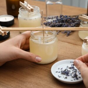 Woman Making Aromatic Candles on a Wooden Table Closeup